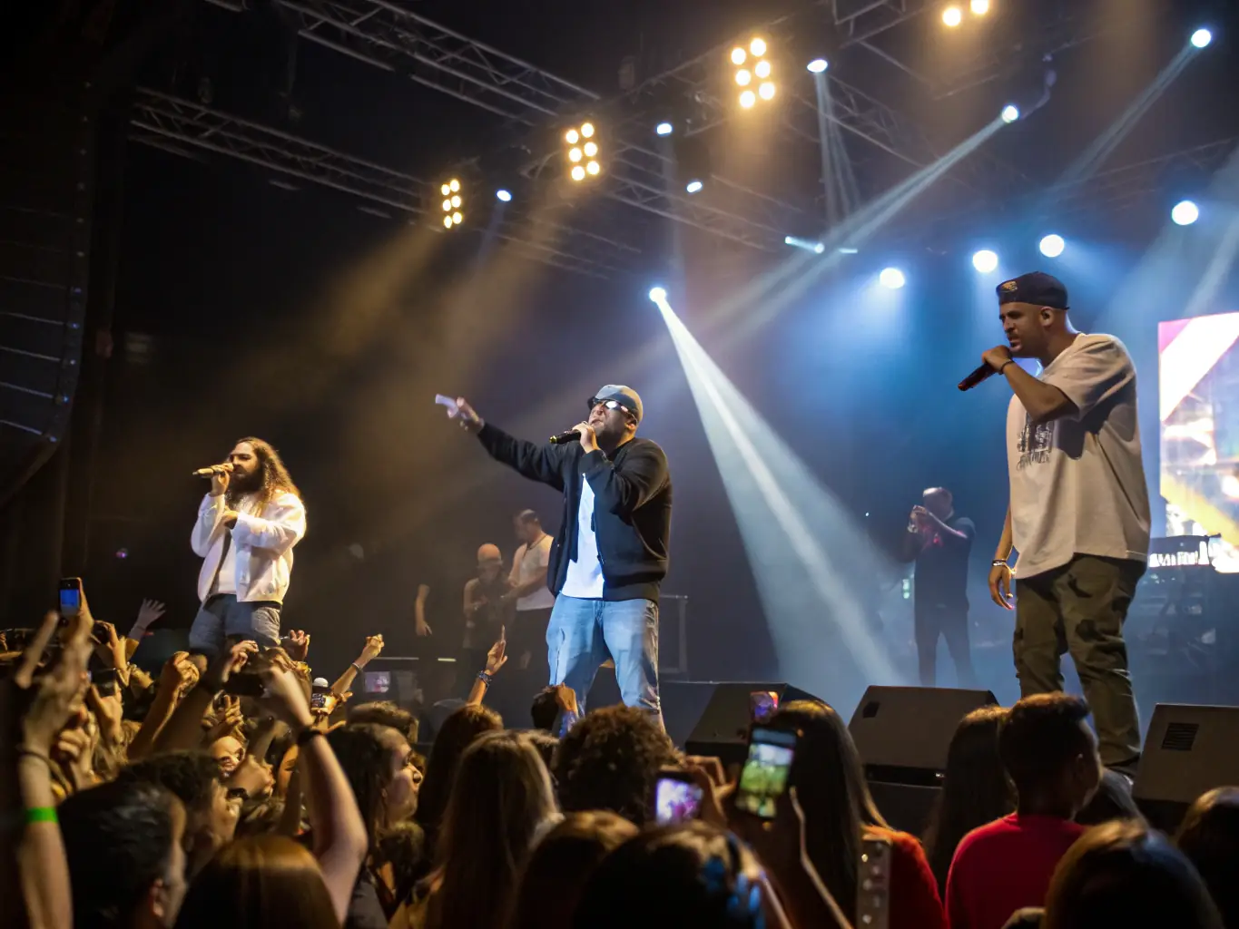 A dynamic image capturing a live performance organized by MANAKIN MUSIC, highlighting the energy and talent of the artists involved.